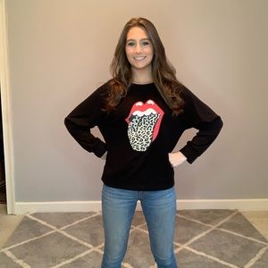 Long sleeve lips top. We have small medium and large.